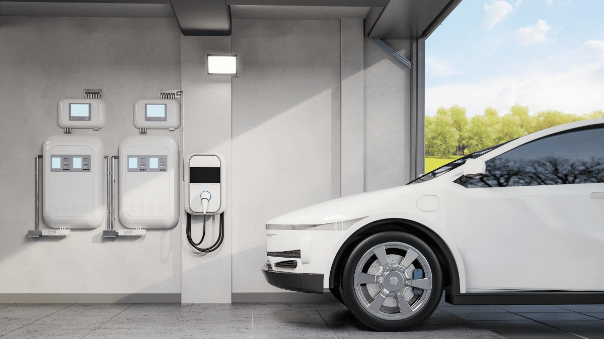 white car next to EV Charging station